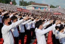 FILE - In this June 6, 2020 file photo, North Korean students stage a rally to denounce South Korea for sending anti-Pyongyang leaflets over the border.