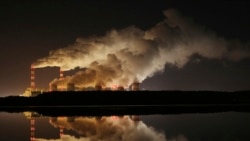 FILE - Plumes of smoke rise from Europe's largest lignite power plant in Belchatow, central Poland, Nov. 28, 2018.