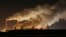 FILE - Plumes of smoke rise from Europe's largest lignite power plant in Belchatow, central Poland, Nov. 28, 2018.