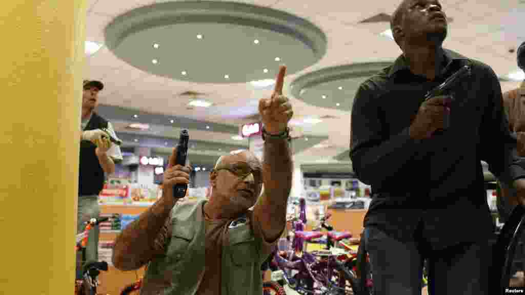 Security officers secure an area inside Westgate Shopping Mall in Nairobi September 21, 2013.