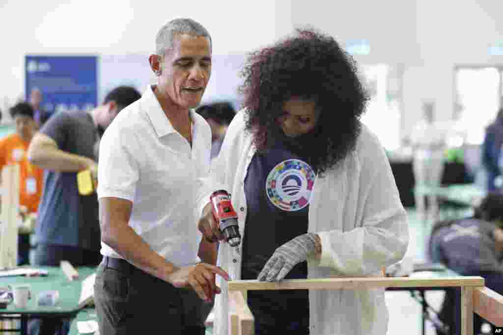 Former U.S. President Barack Obama and former first lady Michelle participate in a community services event during the sidelines of the Obama Foundation in Kuala Lumpur, Malaysia.