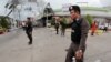 Security forces are seen at the site of a bomb attack at a supermarket in the city of Pattani, Thailand May 9, 2017. 