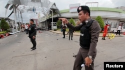 Security forces are seen at the site of a bomb attack at a supermarket in the city of Pattani, Thailand May 9, 2017. 