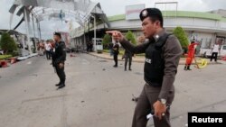 Security forces are seen at the site of a bomb attack at a supermarket in the city of Pattani, Thailand May 9, 2017. 