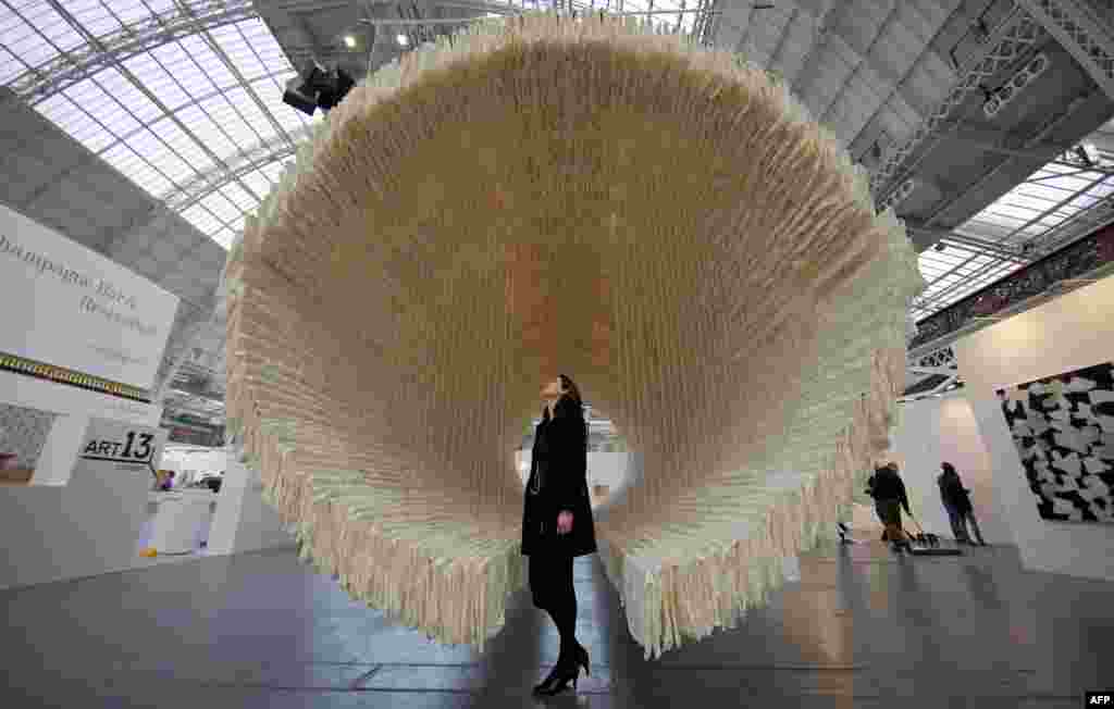 A 12-meter rice paper boat art installation by Chinese artist Zhu Jinshi at the Art13 London art fair in central London, Britain. The boat is made from 10,000 sheets of rice paper which took 14 skilled workers around 50 days to make.