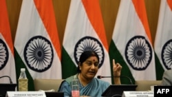 FILE - Indian Foreign Affairs Minister Sushma Swaraj gestures during a press conference in New Delhi.