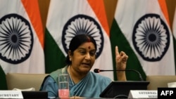 FILE - Indian Foreign Affairs Minister Sushma Swaraj gestures during a press conference in New Delhi on Aug. 22, 2015.