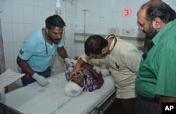 A man injured in a train accident receives treatment at a hospital in Amritsar, India, Oct. 19, 2018.