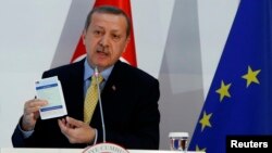 Turkey's Prime Minister Tayyip Erdogan addresses the audience during the Turkey-EU Readmission Agreement Signing Ceremony in Ankara, Dec. 16, 2013.