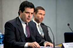 FILE - Tommaso Di Ruzza, director of the Vatican Financial Information Authority, left, talks to the media at the Vatican, April 28, 2016.