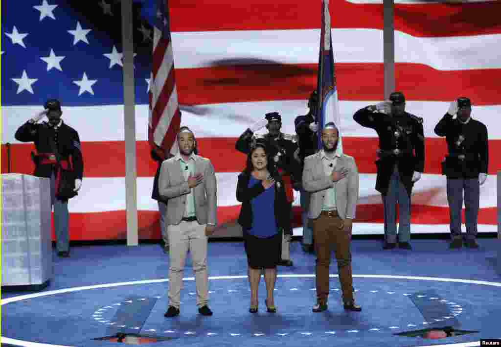 Newly naturalized U.S. citizens lead the U.S. Pledge of Allegiance at the start of the final day of the Democratic National Convention in Philadelphia, Pennsylvania, July 28, 2016.