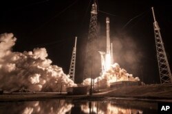 This Jan. 7, 2018 photo made available by SpaceX shows the launch of the Falcon 9 rocket at Cape Canaveral, Fla., for the "Zuma" U.S. satellite mission.