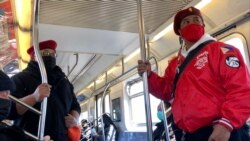 Jose Medina (left) and Chris Carbonell (right) patrols on the 7 train in New York City. (Photo by Janine Phakdeetham)