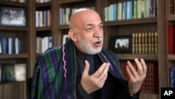 Afghanistan's former president Hamid Karzai speaks during an interview with the Associated Press in Kabul, Afghanistan, Feb. 7, 2018. 
