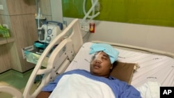 Pro-democracy leader Sirawith Seritiwat is hospitalized following last week's attack in Bangkok, Thailand, July 3, 2019. 