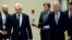 British Secretary of State for Exiting the European Union David Davis, second left, and European Union chief Brexit negotiator Michel Barnier arrive for a media conference at EU headquarters in Brussels, Belgium, Dec. 4, 2017.