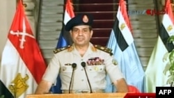 Egyptian army chief Abdel Fattah al-Sisi delivers a statement as the army unveils a roadmap for Egypt's political future, July 3, 2013. (AFP/Egyptian TV) 