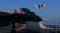 FILE - A live-fire drill using a Chinese aircraft carrier and jets is carried out in the Bohai sea, China, Dec. 14, 2016. 