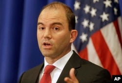 FILE - White House Deputy National Security advisor Ben Rhodes speaks to reporters during a press briefing, Aug. 22, 2014, in Edgartown, Massachusetts.