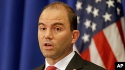 FILE - White House Deputy National Security adviser Ben Rhodes speaks to reporters during a press briefing, in Edgartown, Mass., Aug. 22, 2014.