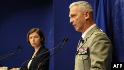 French army chief of staff general Francois Lecointre, right, and French Defense Minister Florence Parly give a press conference in Paris, May 10, 2019, as French forces freed two French hostages as well as an American and a South Korean in Burkina Faso in a military raid.