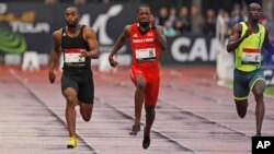 Tyson Gay, left, is on his way to win the men's 100-meter men's ahead of Richard Thompson, center, from Trinidad and Tobago, and Norway's Jaysuma Saidy-Ndure during the Athletics Montreuil meeting at the Jean Delbert stadium, in Montreuil, east of Paris, 