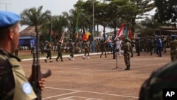 FILE - United Nations peace keeping troops take part in a ceremony in the capital city of Bangui, Central African Republic, Monday, Sept. 15, 2014.
