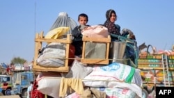 Afghan refugees arrive from Pakistan at the Afghanistan-Pakistan border in Spin Boldak district of Kandahar province on Dec. 3, 2023.