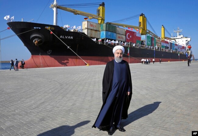 FILE - Iranian President Hassan Rouhani poses during the inauguration of a newly built extension of the port of Chabahar, near the Pakistani border, on the Gulf of Oman, southeastern Iran, Dec. 3, 2017.