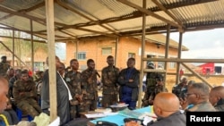 Group of Congolese soldiers, accused of fleeing combat against M23 rebels, take part in their trial, in Lubero, North Kivu Province, Democratic Republic of Congo on July 5, 2024. (Yassin Kombi/REUTERS)