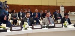 Afghan delegates inside the conference hall included Lotfullah Najafizada (2nd-R), the head of Afghan TV channel Tolo News, in Doha, Qatar, July 7, 2019. U.S special envoy Zalmay Khalilzad is seen center rear, with red tie. (A. Tanzeem/VOA)