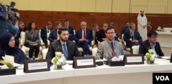 FILE - Afghan delegates inside the conference hall included Lotfullah Najafizada (2nd-R), the head of Afghan TV channel Tolo News, in Doha, Qatar, July 7, 2019. U.S special envoy Zalmay Khalilzad is seen center rear, with red tie. (A. Tanzeem/VOA)