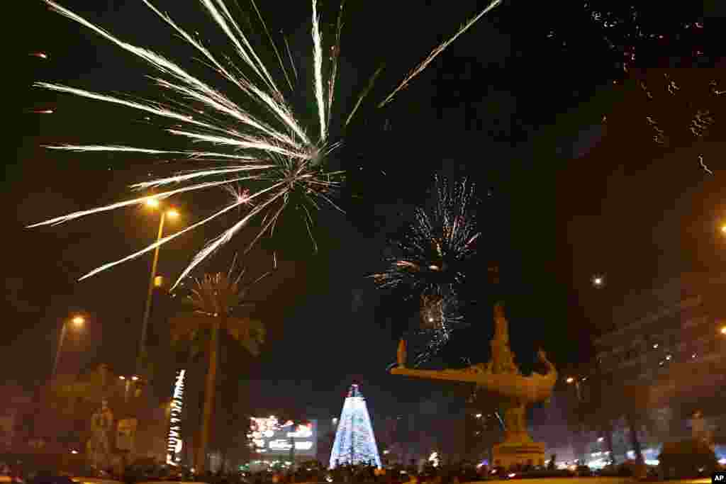 Fireworks light up the sky during New Year's celebrations in Baghdad, Iraq, Jan. 1, 2019. 
