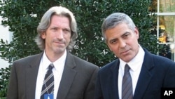 Actor, activist George Clooney (R) with activist John Prendergast