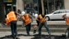 FILE- A crew works on a section of Market Street in San Francisco, Aug. 19, 2011. 