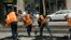 FILE- A crew works on a section of Market Street in San Francisco, Aug. 19, 2011. 