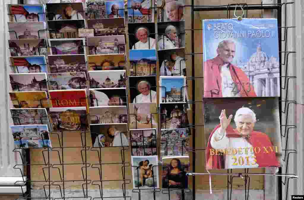 Postcards and calendars are displayed outside a shop at the Vatican February 12, 2013.