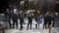 Turkish riot police stand guard in front of the Justice Palace in Istanbul, March 31, 2015.