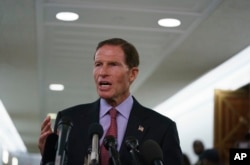 FILE - Senate Judiciary Committee member Sen. Richard Blumenthal, D-Conn., talks to media after a Senate Judiciary Committee hearing on Capitol Hill in Washington, Sept. 28, 2018.