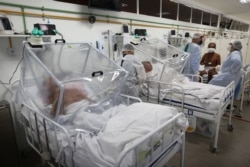 Healthcare workers and patients are shown inside the Intensive Care Unit for COVID-19 of the Gilberto Novaes Hospital in Manaus, Brazil, May 20, 2020.