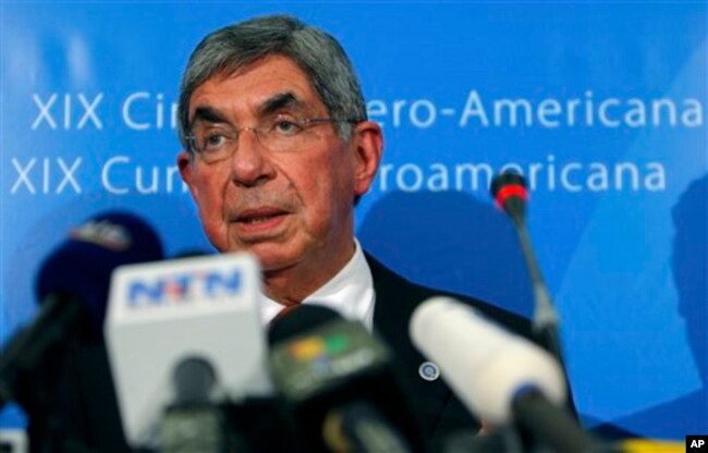 FILE - Costa Rica's President Oscar Arias addresses journalists outside Lisbon, Nov. 30, 2009.