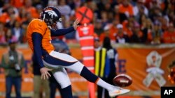 Denver Broncos punter Britton Colquitt punts during an NFL football game between the Denver Broncos and the Kansas City Chiefs.