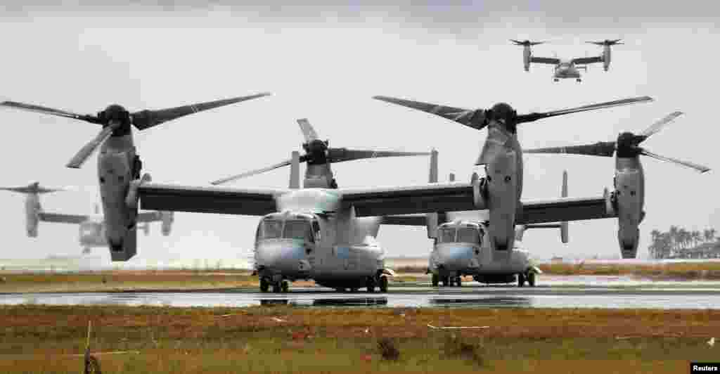 Four Ospreys from the U.S. Navy Ship (USNS) Charles Drew prepare to taxi on the tarmac of Tacloban airport, Philippines, in the aftermath of super Typhoon Haiyan.