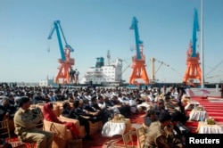 Participants attend the opening ceremony of the Gwadar deep-sea port on the Arabian Sea, west of Karachi, March 20, 2007