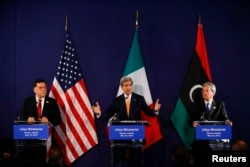 Libyan prime minister-designate Fayez al-Sarraj (L-R), U.S. Secretary of State John Kerry and Italian Foreign Minister Paolo Gentiloni attend a news conference in Vienna, Austria, May 16, 2016.