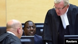 Kenyan Deputy President William Ruto (C) sits in the courtroom of the International Criminal Court in The Hague, May 14, 2013.