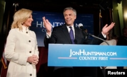 FILE - Republican presidential candidate former Utah Governor Jon Huntsman addresses supporters with his wife, Mary Kaye, at his New Hampshire primary night rally in Manchester, New Hampshire, Jan. 10, 2012.