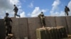 FILE - Somali soldiers are seen at a military base about 450 km south of Mogadishu, Somalia, June 13, 2018.