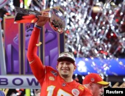 Kansas City Chiefs' Patrick Mahomes celebrates with the Vince Lombardi Trophy after winning Super Bowl LVIII. (REUTERS/Brian Snyder)