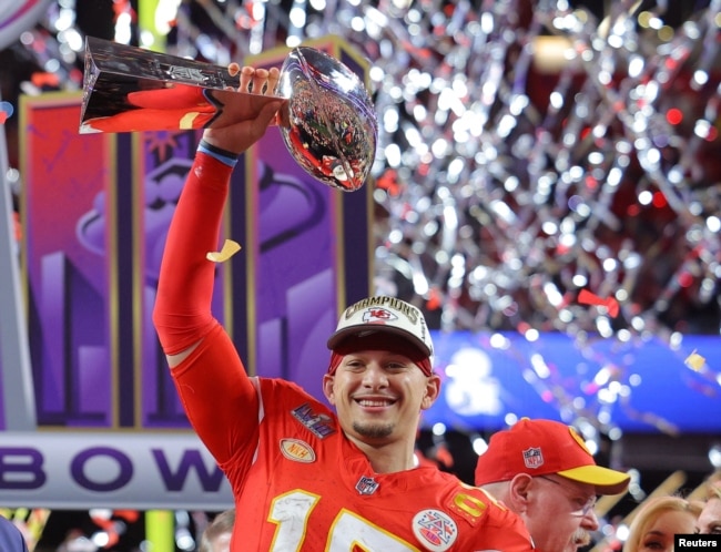 Kansas City Chiefs' Patrick Mahomes celebrates with the Vince Lombardi Trophy after winning Super Bowl LVIII. (REUTERS/Brian Snyder)